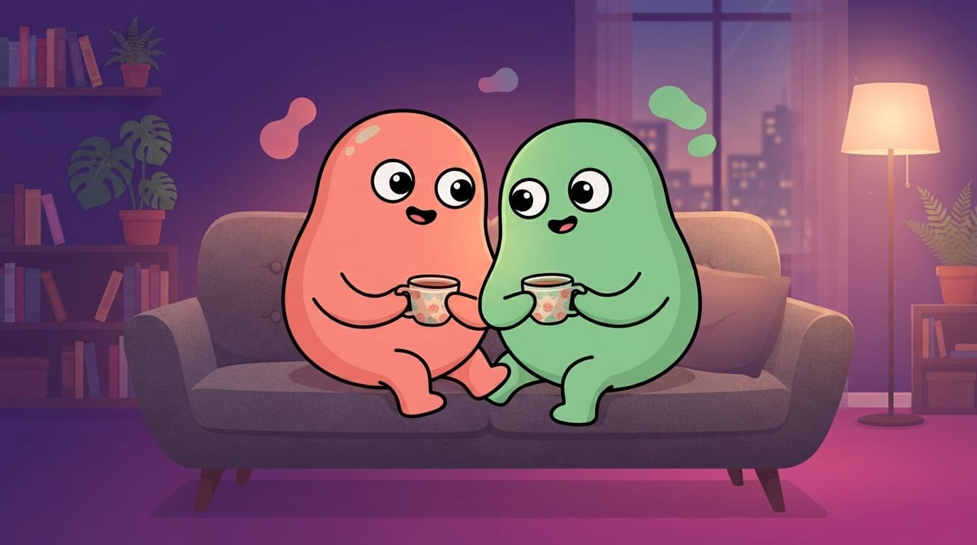 the coral and mint peek partners sit tangled together on a sofa deep in easy conversation, mugs in hand, close and warm but with no charged, reaching-for-each-other spark between them.